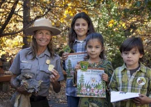 Ranger posing with junior rangers for the Big Thicket Junior Ranger Day