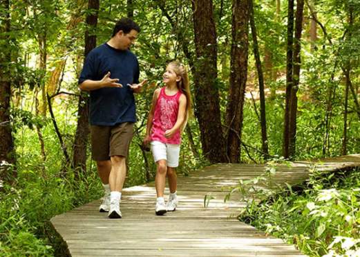 Father and Daughter on Trail Hike in Southeast Texas