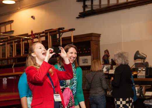 Convention attendee takes photo at Fire Museum conference event