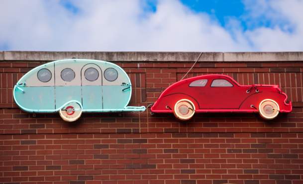 5 Podcast Episodes You Need to Listen to on Your Way to Bentonville, AR