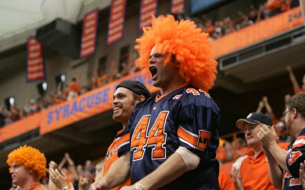 Man in Big Orange Wig and SU Jersey Yells to Support His Team