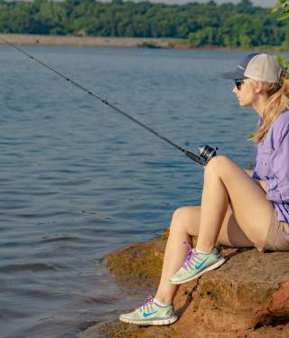 woman fishing at lake