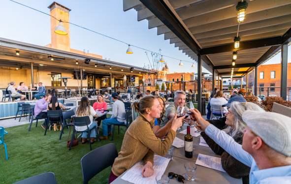 People eating outside at The Mailroom