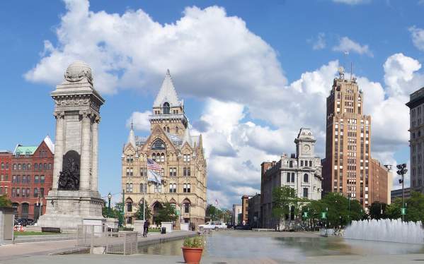 Panorama of Clinton Square with Historic Buidlings and Cloudy Blue Skies