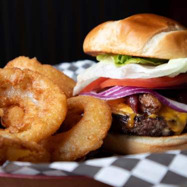 Tree Guys Pizza in Itasca, IL featuring a burger and onion rings