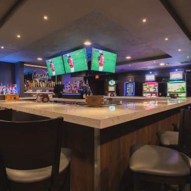 Bar Area With Big Screen Televisions