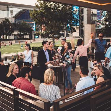 Group of people enjoying an event at Omni Frisco Hotel