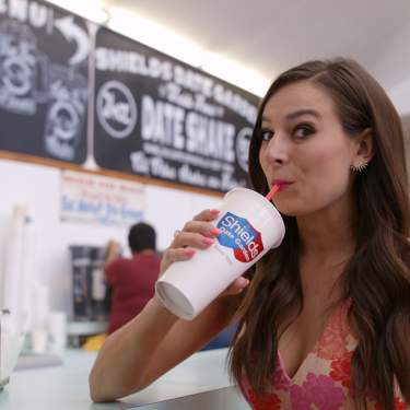 Alle Pierce drinking a date shake from Shield's.