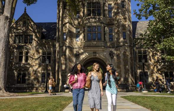 Three female students walking in U-M Law Quad