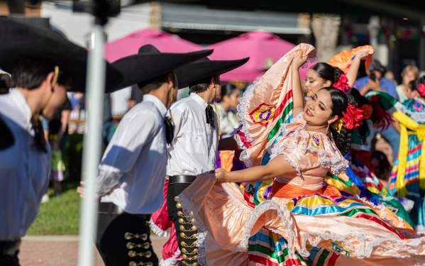 Women dancing in Pat Coursey Park in Jalisco Dresses