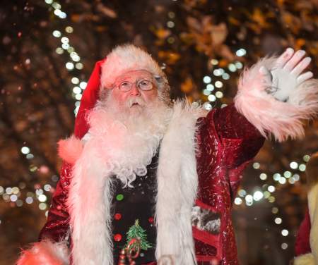 Father Christmas waving from his sleigh in the Swansea Christmas Parade