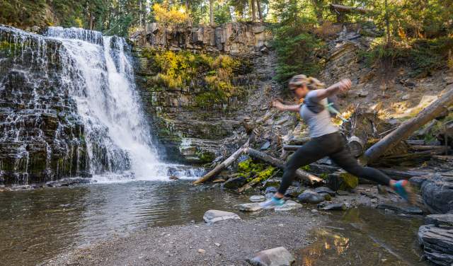 Girl Jumping at Ousel Falls