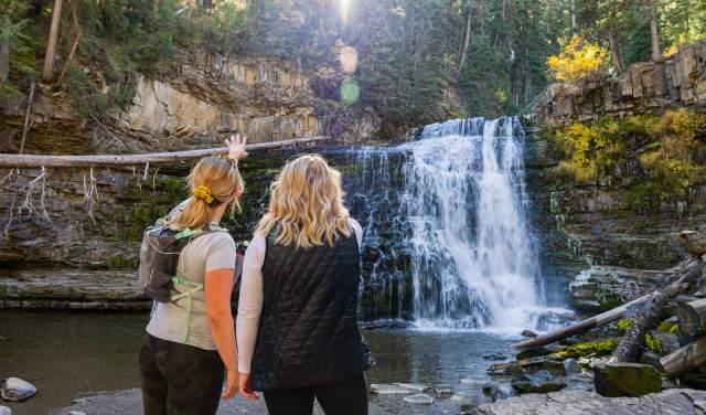 Two Girls looking at the Ousel Falls Waterfall