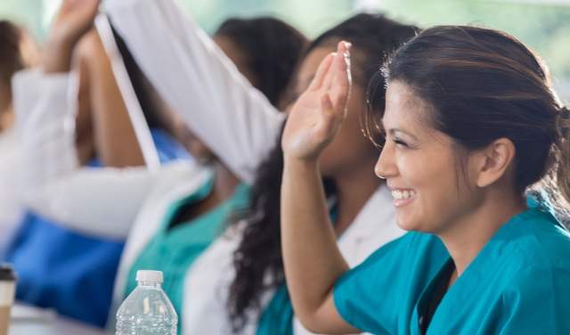 Banner Health - Nurse Raising Hand