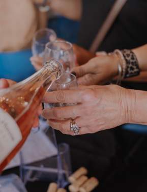 Rosé being poured into glasses at a Loudoun County winery during spring rosé season