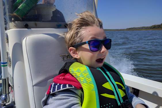 Boy in a boat on a lake