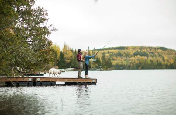 Gunflint Trail Couple Fishing off dock on lake