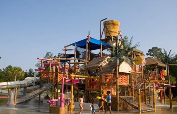 People playing around the Big Splash Treehouse