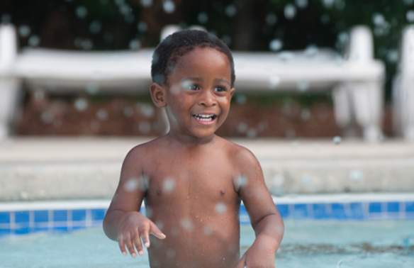 Young boy in shallow water of Lily Pad Lagoon