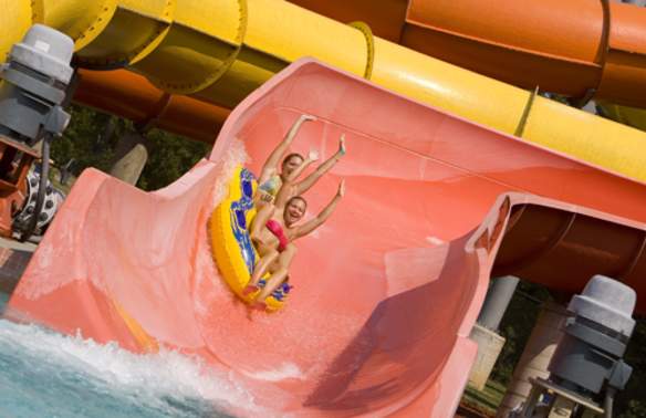 People sliding on tubes down the Tubular Twister