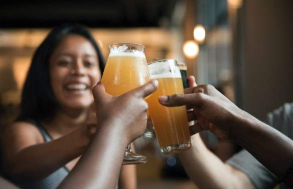 Visitors toasting drinks during a night out in Rocky Mount, NC