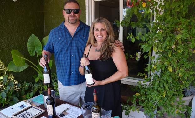 Volunteers Pour Wine at the Wine and Art Stroll