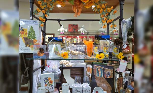A Full shelving display with various California and Golden State merchandise, featuring the State Bear and Flowers