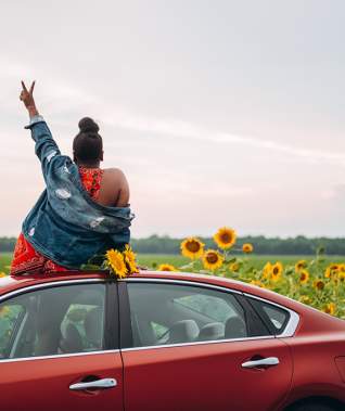 Woman in sunflower field on Boom or Bust Byway in northwest Louisiana