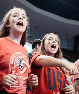 A photo of a crowd at a volleyball game
