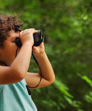Boy - binoculars side view
