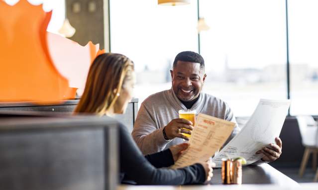 Couple Looks at the Menu at Becket's in Oshkosh