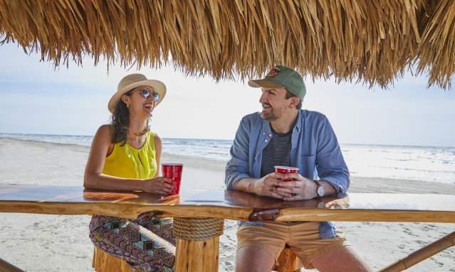 Couple Drinking on Beach