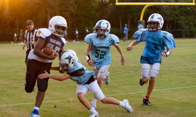 Young boys playing football.