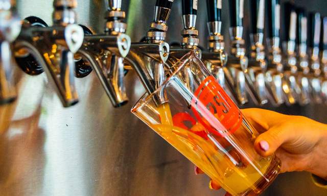 Glass being filled by a beer tap