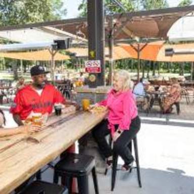 Image of two ladies and a male enjoying beers at Dirtbag Ales Brewery & Taproom