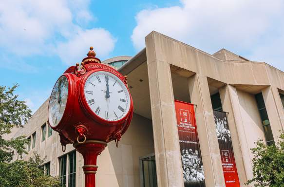 A red clock tower on IU's campus