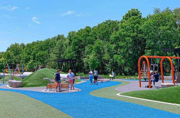 People playing at the Switchyard Park playground