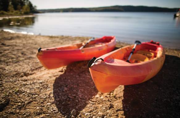 Kayaks on the shore of Monroe Lake