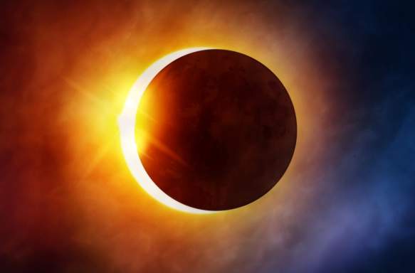 The moon passing in front of the sun during a total solar eclipse