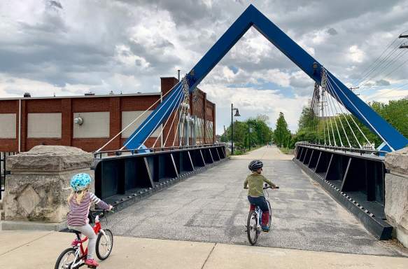 Two kids riding bikes on the B-Line Trail