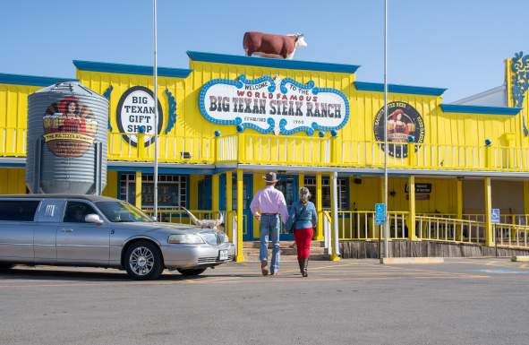 A couple walking in to Big Texan in Amarillo, Texas