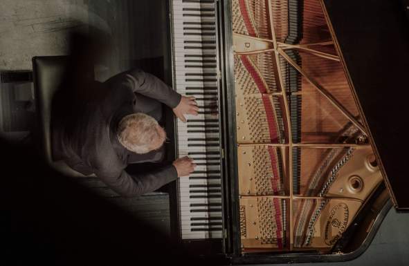 Man playing the piano from above