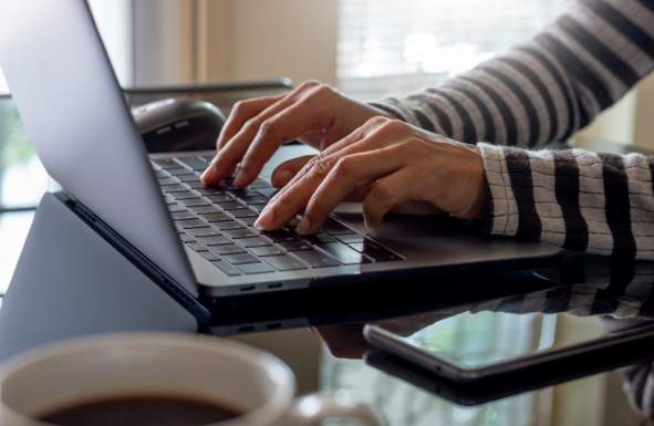 Hands Typing on Keyboard