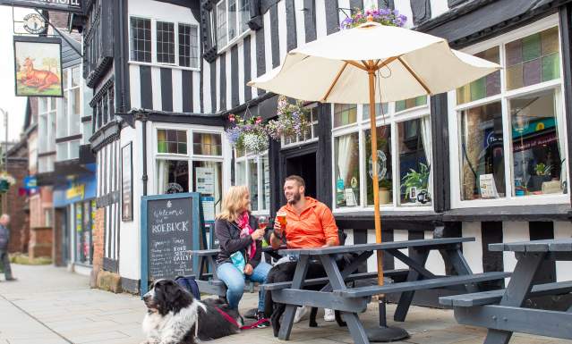 The Roebuck Leek couple drink outside with dogs