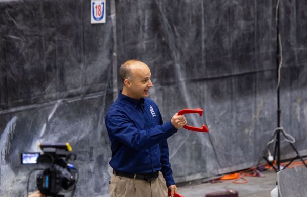 Mayor Andy Schor tosses a horseshoe