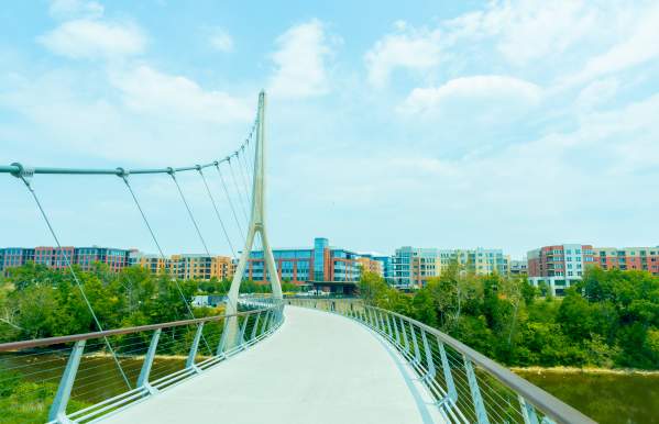 The view of the walkway of the Dublin Link pedestrian bridge headed towards Bridge Park.