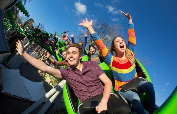 Drayton Manor Resort Theme Park Thrills arms in the air on Accelerator rollercoaster