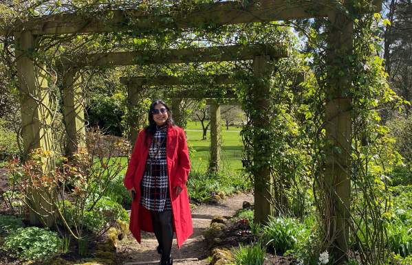 garden with visitor in red coat