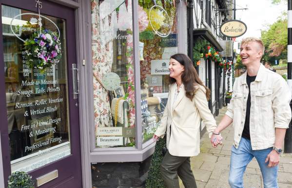 couple enter shop High Street