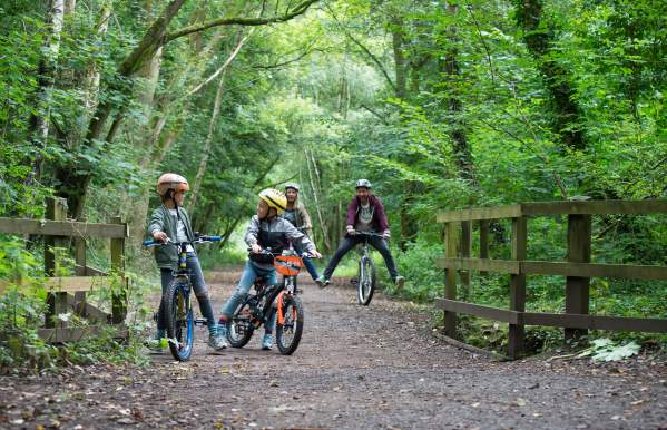 family cycling along Churnet Valley Way
